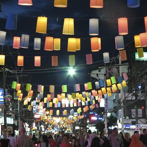 Colorful lanterns above a busy Patong night market street in Phuket